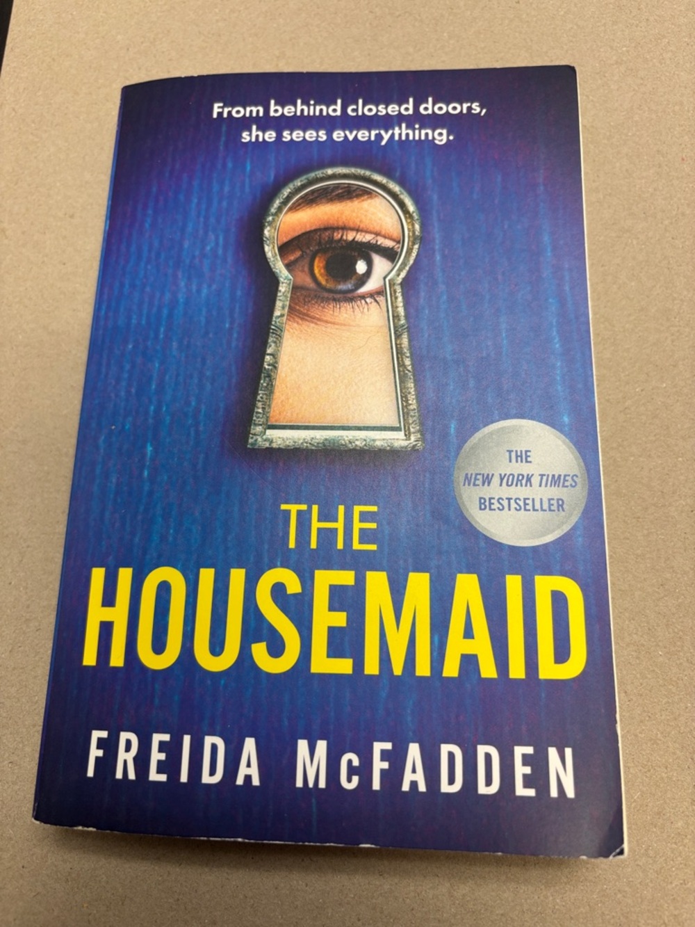 The Housemaid by Freida McFadden - Blue & Yellow Paperback